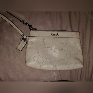 Pink Coach patent leather perforated C monogram wristlet